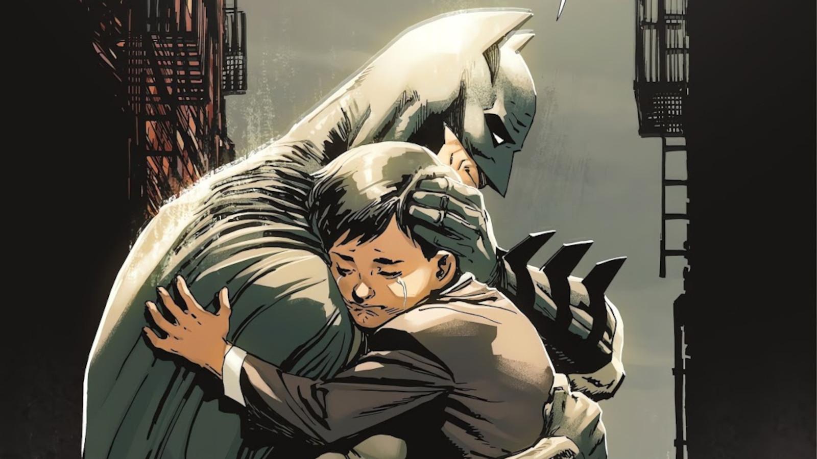 Batman hugs a young Bruce Wayne.